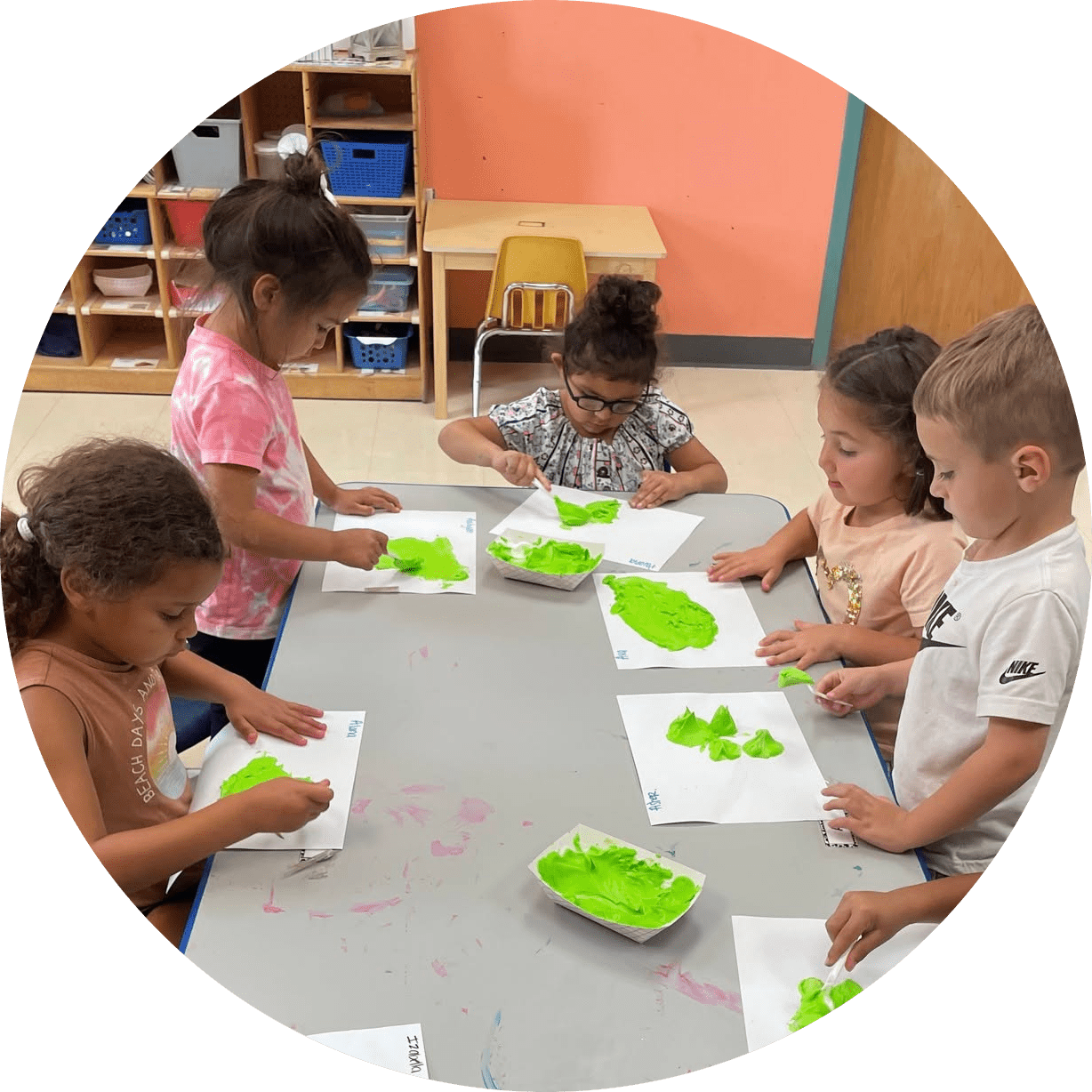 little step goop-modified A group of children playing with goop in the learning center